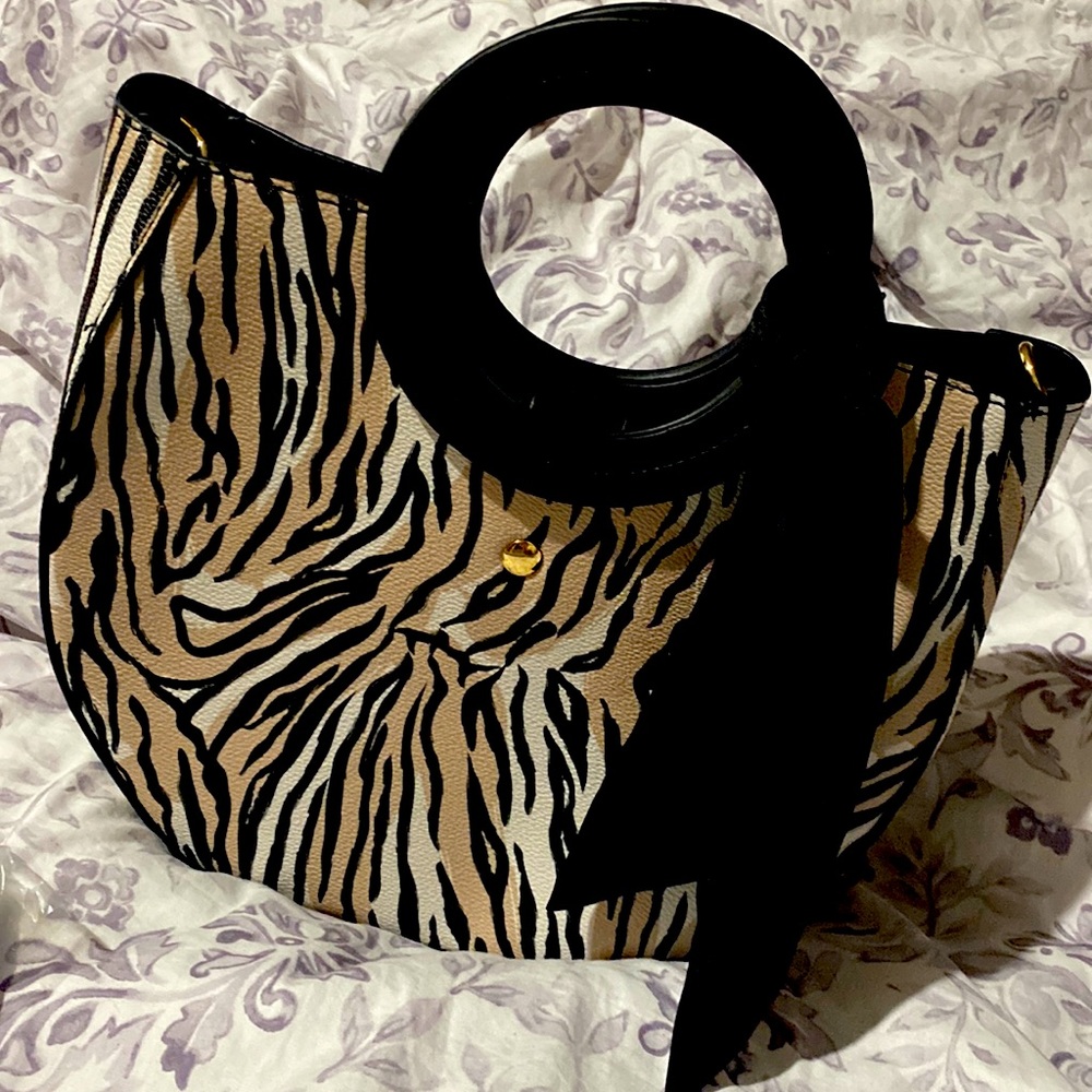 Zebra- printed luxurious handbag